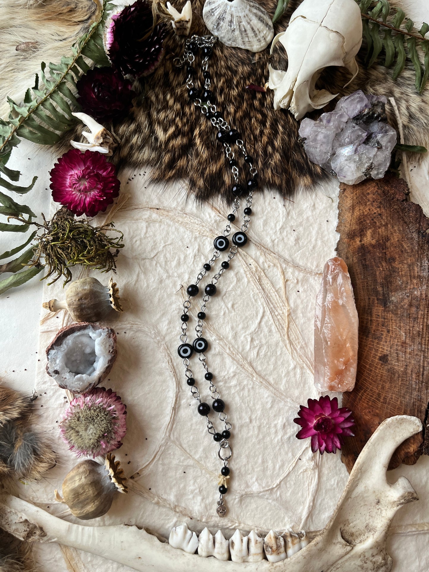 Evil Eye with Skull Charm Snake Vertebra Necklace